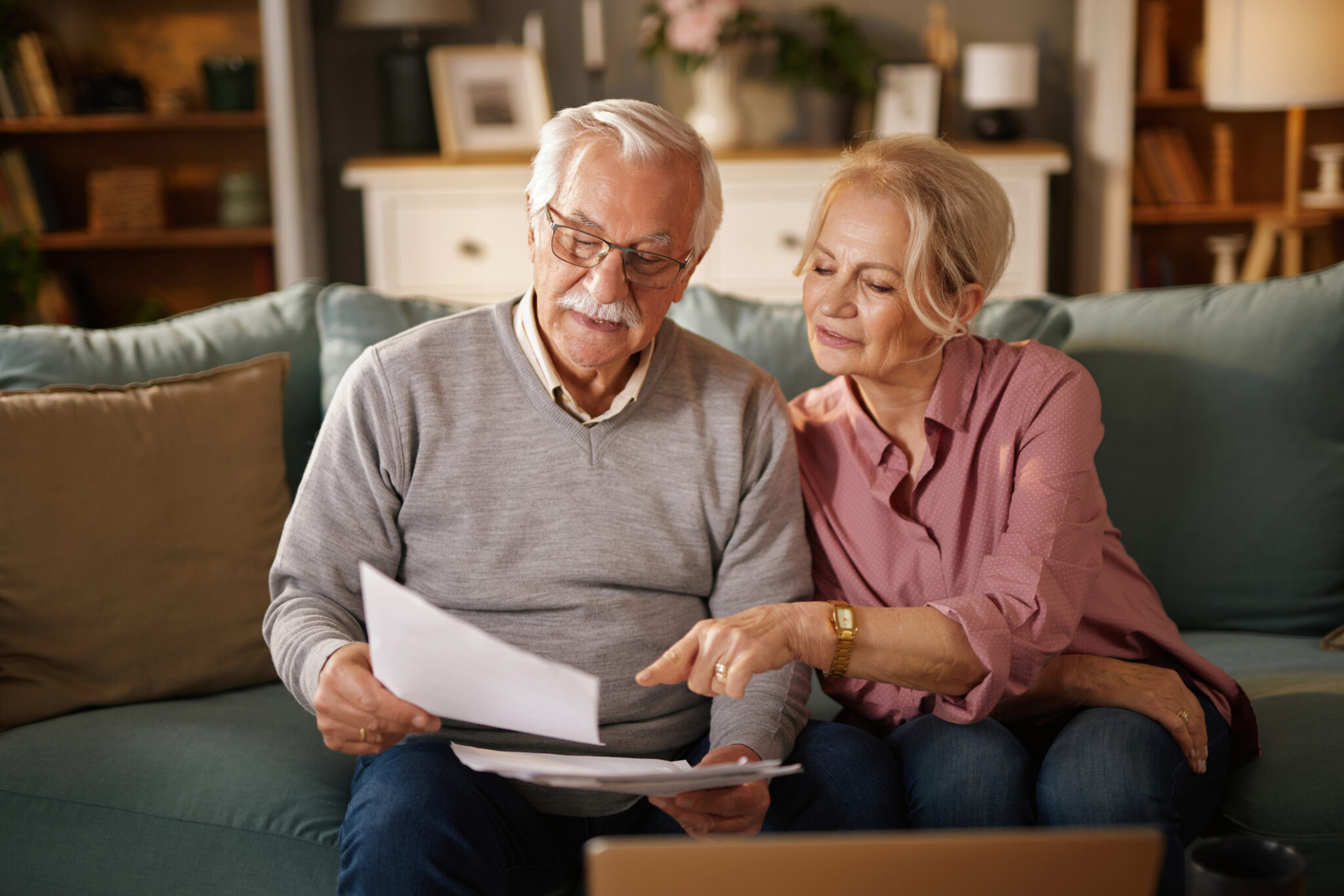 Elderly couple reviewing documents together