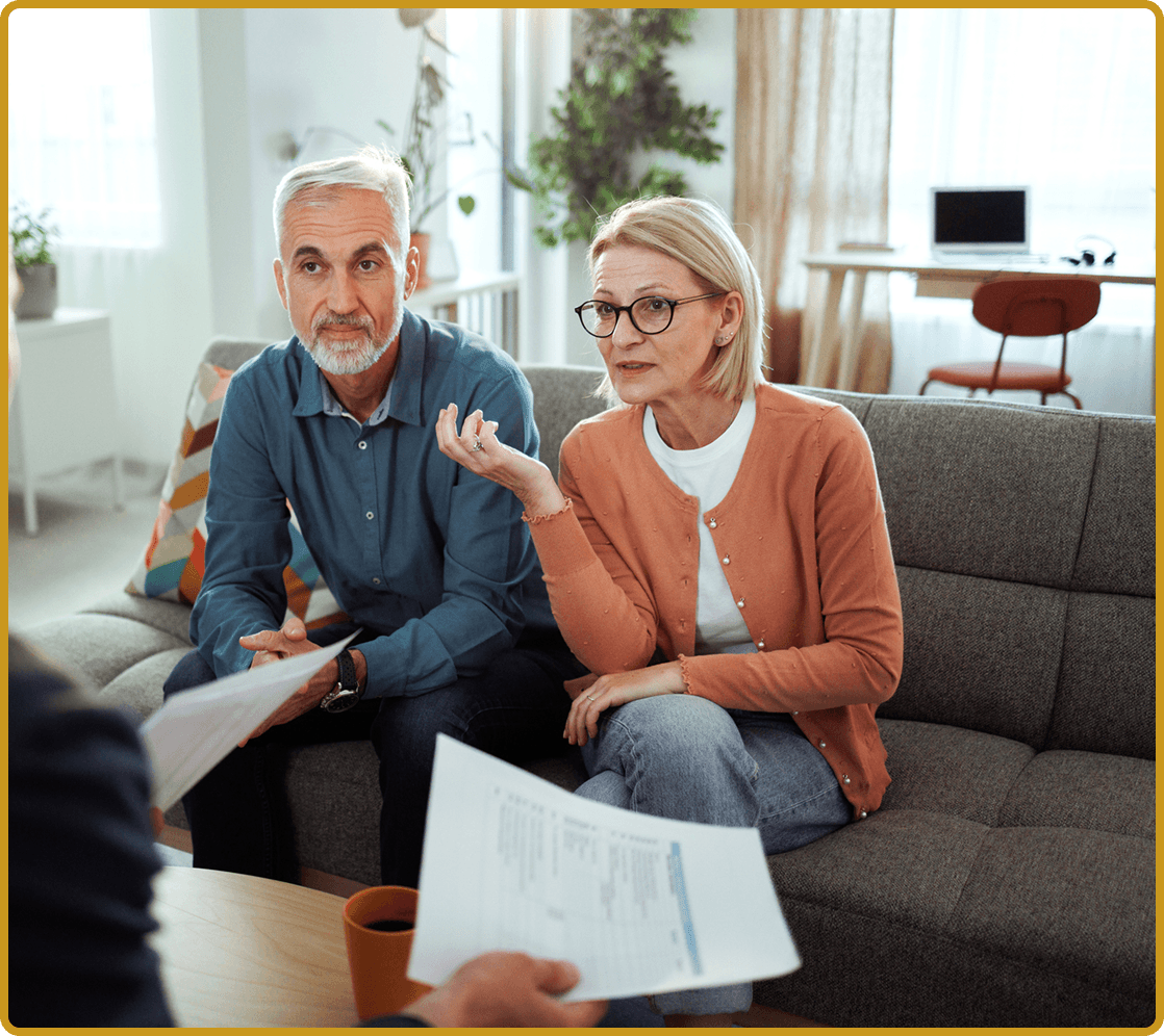 Elderly couple consulting with advisor