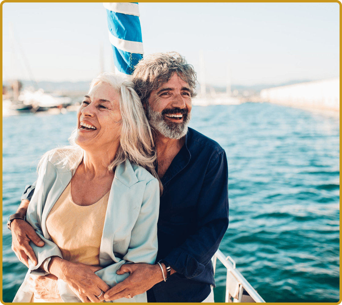 Smiling couple embracing on a yacht